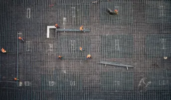 workers-building-metal-installation-on-building-just-transition